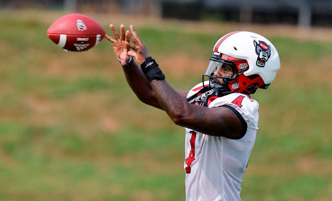 N.C. State wide receiver Porter Rooks (4) pulls in a pass during the Wolfpack’s first fall practice in Raleigh, N.C., Wednesday, August 2, 2023. Ethan Hyman/ehyman@newsobserver.com