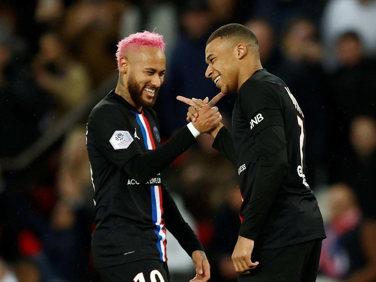 PSG's Kylian Mbappe celebrates scoring their fourth goal with Neymar: REUTERS