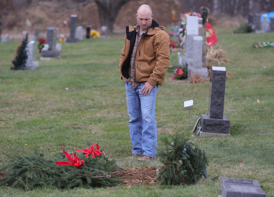 Frank "Keith" Malinowski visits a gravesite in Doylestown, Ohio.