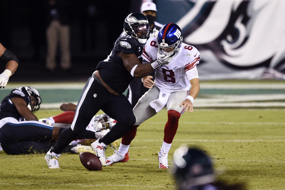 New York Giants' Daniel Jones (8) fumbles after being hit by Philadelphia Eagles' Brandon Graham (55) during the second half of an NFL football game, Thursday, Oct. 22, 2020, in Philadelphia. (AP Photo/Derik Hamilton)