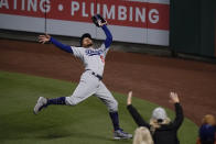 Los Angeles Dodgers' Mookie Betts catches a fly ball hit by Los Angeles Angels' Taylor Ward during the fourth inning of a baseball game, Friday, May 7, 2021, in Anaheim, Calif. (AP Photo/Jae C. Hong)