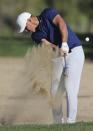 Brooks Koepka from the U.S. plays a shot on the 16th dirt during the second round of the Abu Dhabi Championship golf tournament in Abu Dhabi, United Arab Emirates, Friday, Jan. 17, 2020. (AP Photo/Kamran Jebreili)