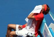 Germany's Alexander Zverev holds a towel to his bleeding nose before receiving medical treatment for it during his first round match against Britain's Andy Murray at the Australian Open tennis tournament at Melbourne Park, Australia, January 19, 2016. REUTERS/Jason O'Brien Picture Supplied by Action Images