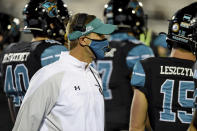 Coastal Carolina head coach Jamey Chadwell, center, walks the sideline during the first half of an NCAA college football game against BYU Saturday, Dec. 5, 2020, in Conway, S.C. (AP Photo/Richard Shiro)