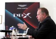 CEO of Aston Martin Andy Palmer speaks during an interview before a global launch ceremony of the company's first sport utility vehicle Aston Martin DBX in Beijing