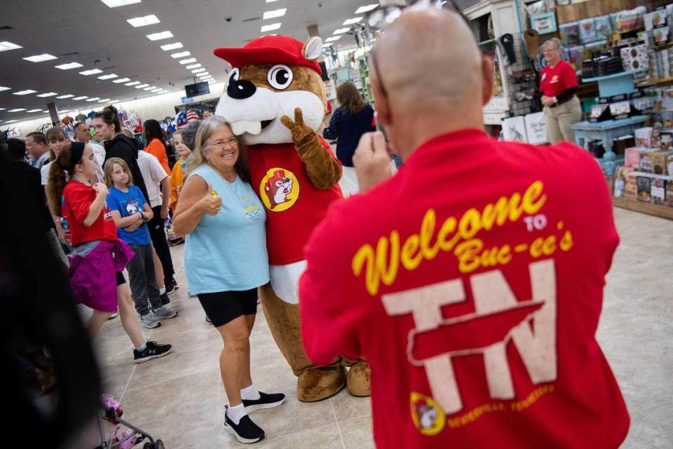 Customers take photos with the Buc-ee’s beaver mascot during the grand opening of Buc-ee’s in Sevierville on Monday, June 26, 2023.