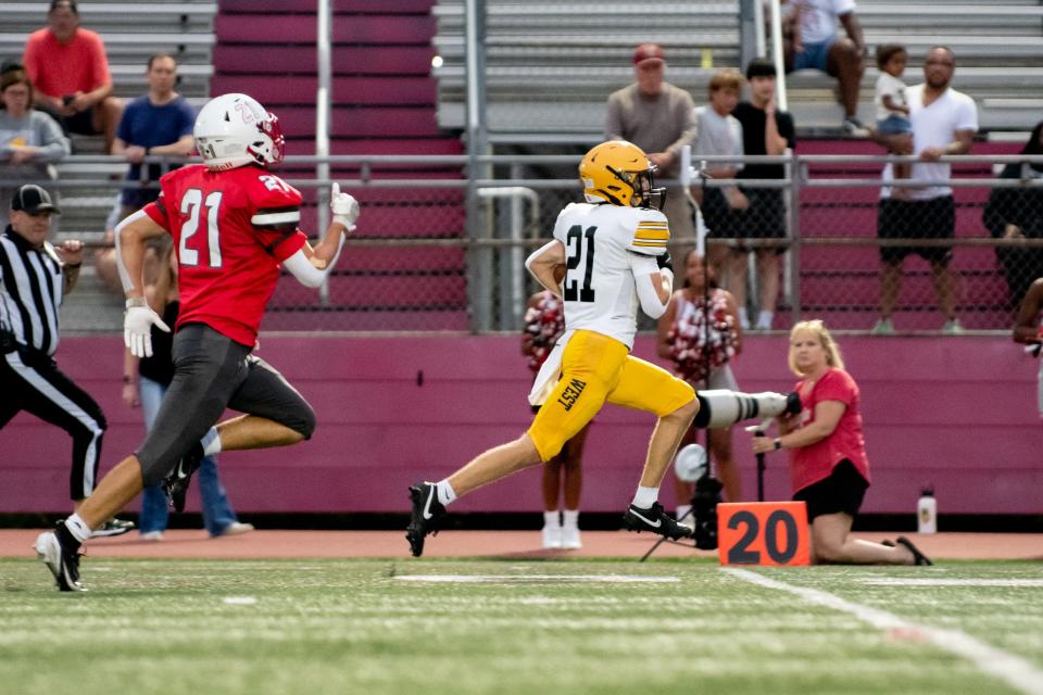 Central Bucks West running back Vance Morelli runs the ball for a 76-yard touchdown reception in a football game, Thursday, August 29, 2024, at Upper Dublin High School.