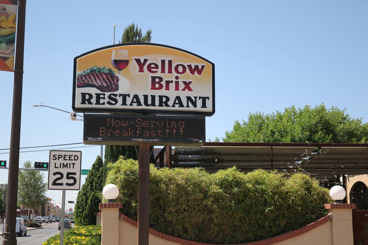 Yellow Brix Restaurant announces its new breakfast menu on its sign, May 1, 2024 on South Canal Street in Carlsbad.
