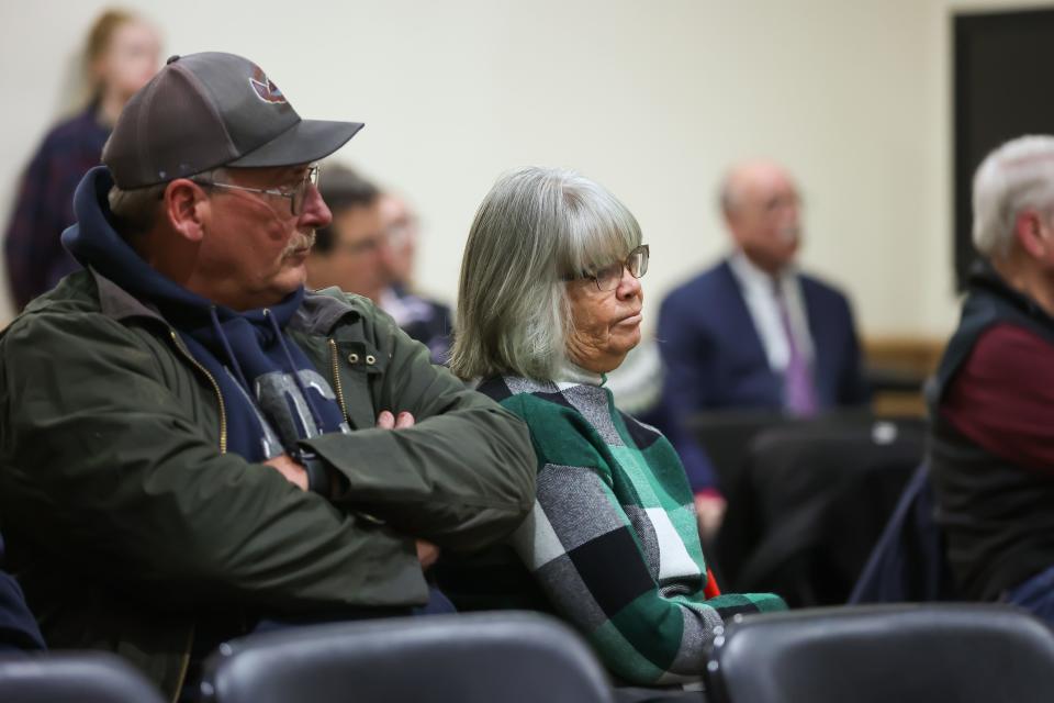 North Hampton resident Lori Cotter listens during a public hearing regarding the proposal to take her property by eminent domain for a cell tower.