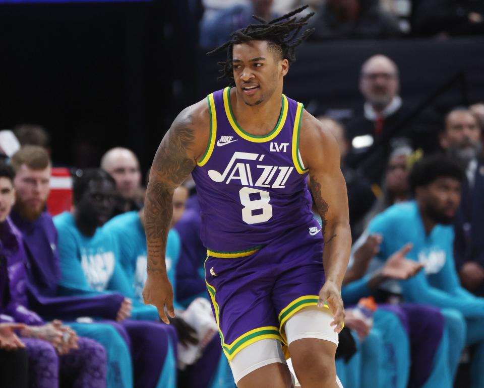 Utah Jazz forward Brice Sensabaugh (8) celebrates a basket in Salt Lake City on Thursday, Feb. 22, 2024.