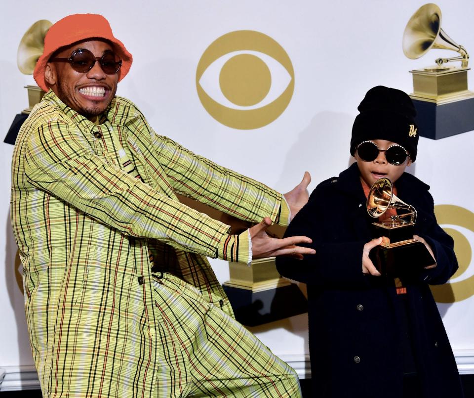 Anderson .Paak and his son Soul Rasheed poses with his award for best rap performance in the press room during the 61st Annual Grammy Awards on February 10, 2019, in Los Angeles.