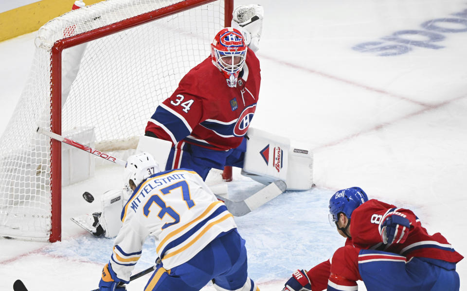 Montreal Canadiens goaltender Jake Allen is scored on by Buffalo Sabres' Casey Mittelstadt during the second period of an NHL hockey game Thursday, Jan. 4, 2024, in Montreal. (Graham Hughes/The Canadian Press via AP)