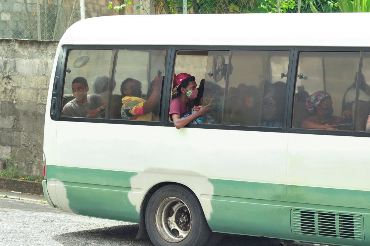 Evacuees travel by bus as they leave a village following the eruption of La Soufriere volcano on the eastern Caribbean island of St. Vincent April 9, 2021.  REUTERS/Robertson S. Henry