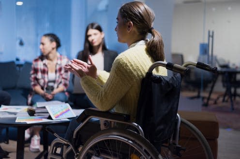 <span class="caption">Only 9% of London firms reported that they collect data on their disability pay gap.</span> <span class="attribution"><a class="link " href="https://www.shutterstock.com/image-photo/handicapped-young-woman-colleagues-working-office-1669501207" rel="nofollow noopener" target="_blank" data-ylk="slk:as-artmedia/Shutterstock;elm:context_link;itc:0;sec:content-canvas">as-artmedia/Shutterstock</a></span>