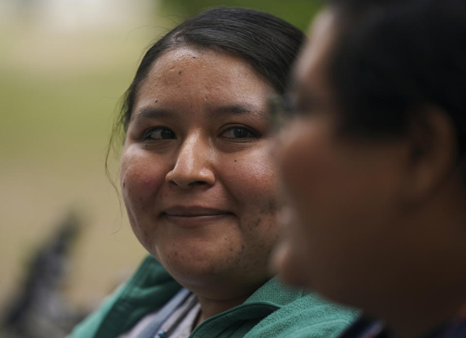 Dayanny Marcelo, right, looks at her fiancé Mayela Villalobos during an interview, one day prior to a massive wedding ceremony organized by city authorities as part of the LGBT pride month celebrations in Mexico City, Thursday, June 23, 2022. Marcelo and Villalobos had for years been forced to keep their relationship a secret because same-sex unions are frowned upon in the southern state of Guerrero, but they have decided to defy discrimination and travel to the Mexican capital to formalize their relationship. (AP Photo/Fernando Llano)