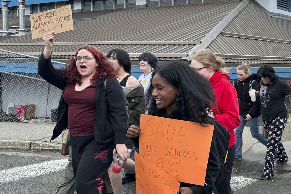 Students and supporters walk from Juneau-Douglas High School: Yadaa.at Kalé to the state Capitol, Thursday, April 4, 2024, in Juneau, Alaska. They marched to the Capitol as part of a student walkout to protest Republican Gov. Mike Dunleavy's veto of an education package last month and the Legislature's failure to override that veto. (AP Photo/Becky Bohrer)