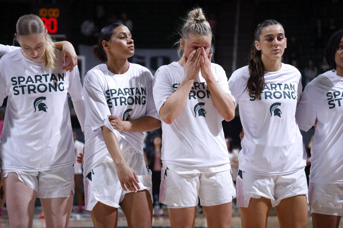Michigan State players including Stephanie Visscher, from left, Moira Joiner, Theryn Hallock and Abbey Kimball stand together before an NCAA college basketball game against Maryland, Saturday, Feb. 18, 2023, in East Lansing, Mich. (AP Photo/Al Goldis)