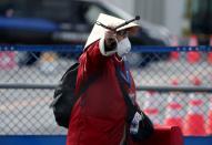 A passenger is seen after walking out from the cruise ship Diamond Princess in Yokohama