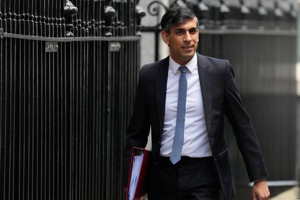 Rishi Sunak leaves 10 Downing Street to attend the weekly Prime Ministers' Questions (AP)