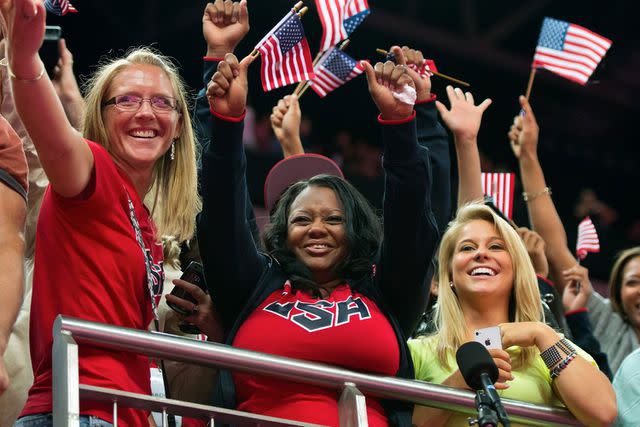 <p>David Eulitt/Kansas City Star/Tribune News Service via Getty</p> Natalie Hawkins cheering at the 2012 Summer Olympics