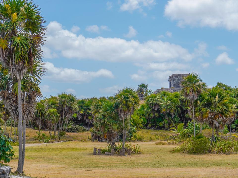 Mayan ruins in Tulum on a partly-cloudy day