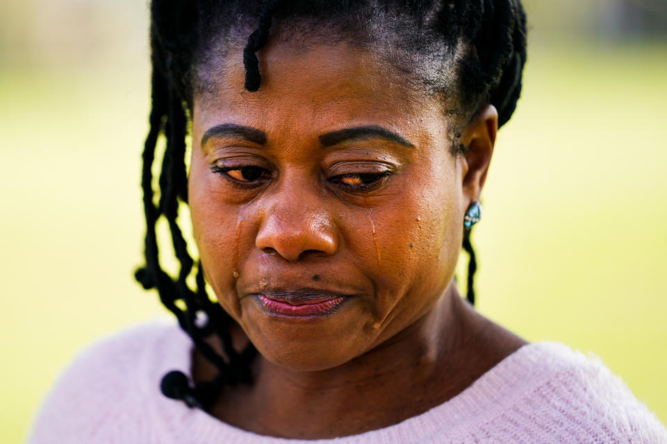 Eva Gbaa, whose 17-year-old nephew John "JJ" Gbaa Jr. was killed in a November 2018 hit-and-run as he tried to cross Roosevelt Boulevard, pauses as she speaks during an interview with The Associated Press in Philadelphia, Friday, April 29, 2022. (AP Photo/Matt Rourke)