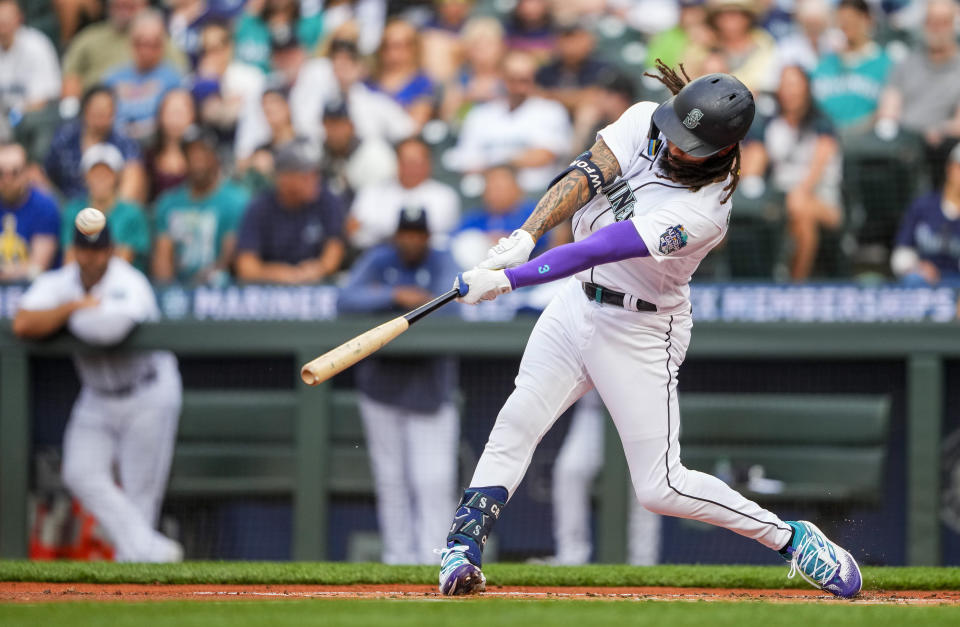 Seattle Mariners' J.P. Crawford hits a solo home run against Washington Nationals starting pitcher Trevor Williams during the first inning of a baseball game Monday, June 26, 2023, in Seattle. (AP Photo/Lindsey Wasson)
