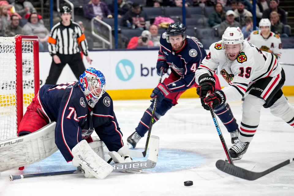 Dec 31, 2022; Columbus, Ohio, USA;  Columbus Blue Jackets goaltender Joonas Korpisalo (70) makes a save attempt while Chicago Blackhawks center Jonathan Toews (19) tries to score during the second period of the NHL hockey game between the Columbus Blue Jackets and the Chicago Blackhawks at Nationwide Arena on Saturday afternoon.