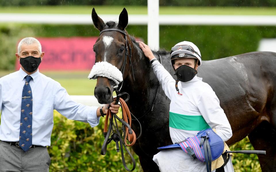 Berlin Tango and David Probert after winning the Unibet Classic Trial Stakes (Group 3) (Class 1), as racing resumes behind closed doors following the outbreak of the coronavirus disease (COVID-19), Sunbury-on-Thames, Britain, June 3, 2020 - REUTERS