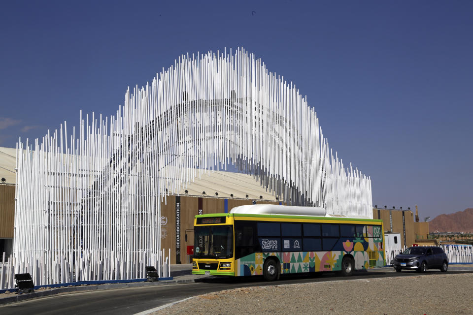 A new hybrid electric bus is parked at an entrance of the conference center complex for this year’s United Nations global summit on climate change, known as COP27, in Sharm el-Sheikh, South Sinai, Egypt, Wednesday, Nov. 2, 2022. As this year’s United Nations climate summit approaches, Egypt’s government is touting its efforts to make Sharm el-Sheikh a more eco-friendly tourist destination. (AP Photo/Thomas Hartwell)