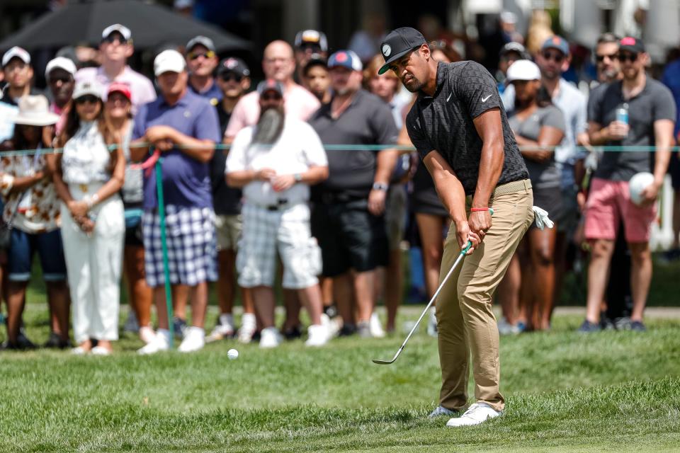 Tony Finau hits the ball out of the rough on the second hole and makes the shot for a birdie during Round 3 of the Rocket Mortgage Classic at the Detroit Golf Club in Detroit on Saturday, July 30, 2022.