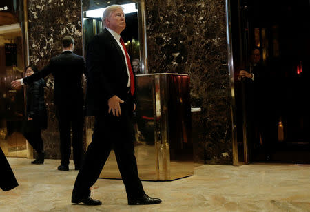 U.S.President-elect Donald Trump makes an appearance in the lobby at Trump Tower in New York, U.S., January 13, 2017. REUTERS/Mike Segar