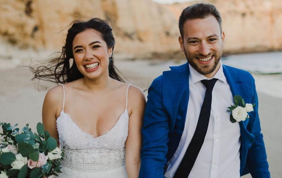 Caroline Crouch and Charalambos (Babis) Anagnostopoulos on their wedding day in Praia Do Canavial, Portugal - Athena Picture Agency Ltd