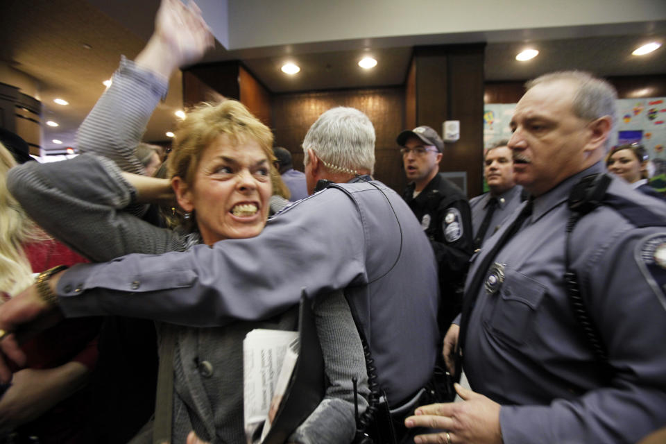 Pro-choice advocate Margaret Doyle from Richmond, Va., is removed by Capitol Police from the General Assembly Building in Richmond after HB1, the bill that states human life begins at conception, passed the Senate Education and Health committee on Thursday, Feb. 23, 2012. Eight Republicans voted for the measure, and the committee's seven Democrats opposed it after an hour-long hearing on the bill that is similar to one in Missouri. The vote now sends the bill to the full Senate where Democrats and Republicans hold 20 seats apiece. (AP Photo/Richmond Times-Dispatch, Bob Brown)