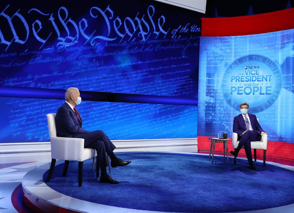 Democratic presidential nominee Joe Biden and ABC News Chief Anchor George Stephanopoulos at the beginning of a town hall meeting at the National Constitution Center in Philadelphia.