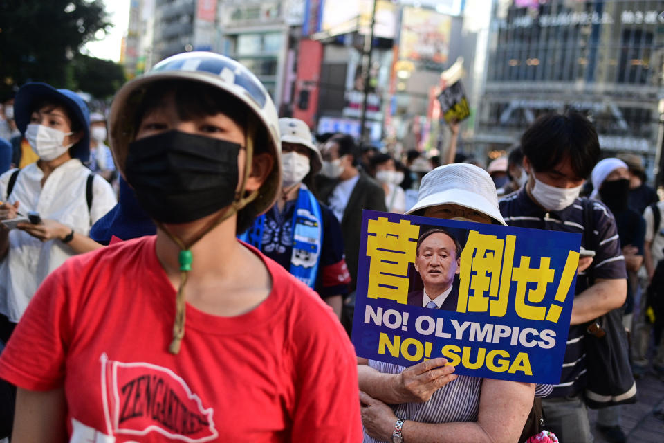 <p>People protest against the hosting of the Tokyo 2020 Olympic Games in Tokyo on July 23, 2021. (Photo by Philip FONG / AFP) (Photo by PHILIP FONG/AFP via Getty Images)</p> 