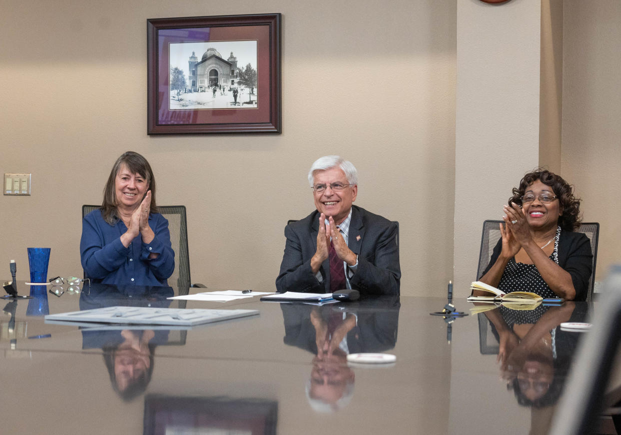 New Mexico State University Regents Professor Martha Desmond, NMSU Chancellor Dan Arvizu and NMSU Interim Provost Dorothy Campbell clap after Arvizu signed an memorandum of understanding with the U.S. Department of Fish and Wildlife and the University of Texas at San Antonio. April 11, 2022.