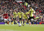 Burnley's Zeki Amdouni scores his side's first goal by a penalty during the English Premier League soccer match between Manchester United and Burnley at Old Trafford, Manchester, England, Saturday, April 27, 2024. (Ian Hodgson/PA via AP)