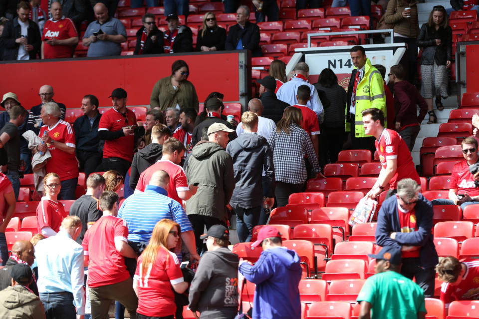 Fans are evacuated prior to the Barclays Premier League match between Manchester United and AFC Bournemouth at Old Trafford on May 15, 2016, in Manchester, England. (Alex Morton/Getty Images)