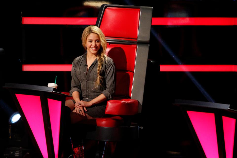 Shakira sitting in chair on The Voice