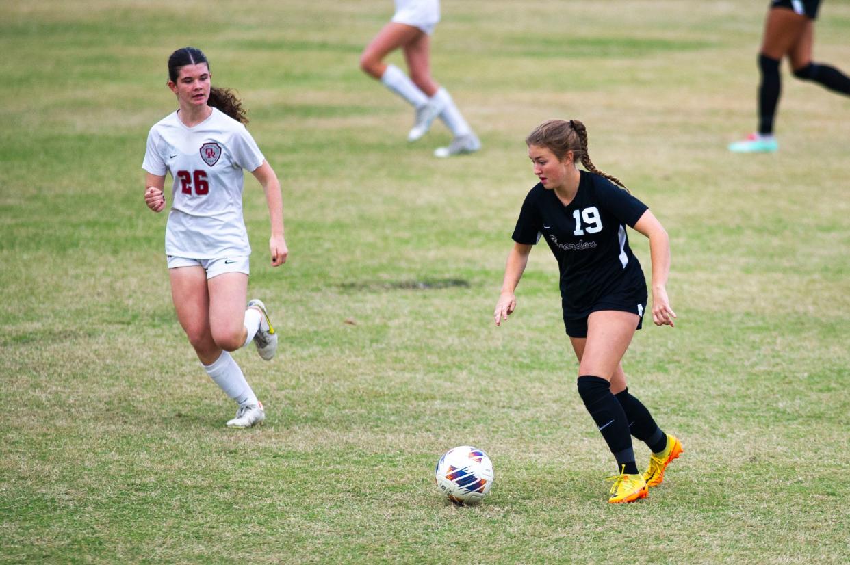 Bearden's Tyler Roth (19) kicks the ball during the Class AAA Region 2 tournament for high school girls varsity soccer at Bearden High School on Tuesday, Oct. 17, 2023.