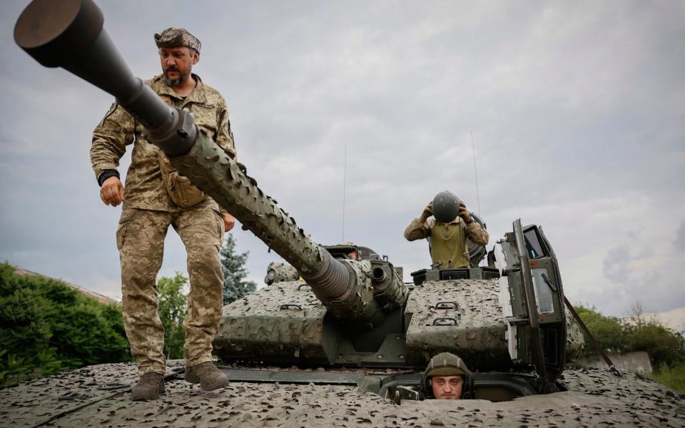 Ukrainian soldiers on a Swedish CV90 infantry fighting vehicle