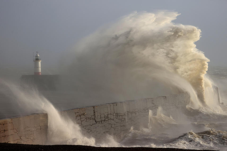 Waves crash over Newhaven Lighthouse and the breakwater in Newhaven on January 2, 2024, as Storm Henk brought strong winds and heavy rain across much of southern England. (Photo by ADRIAN DENNIS / AFP) (Photo by ADRIAN DENNIS/AFP via Getty Images)