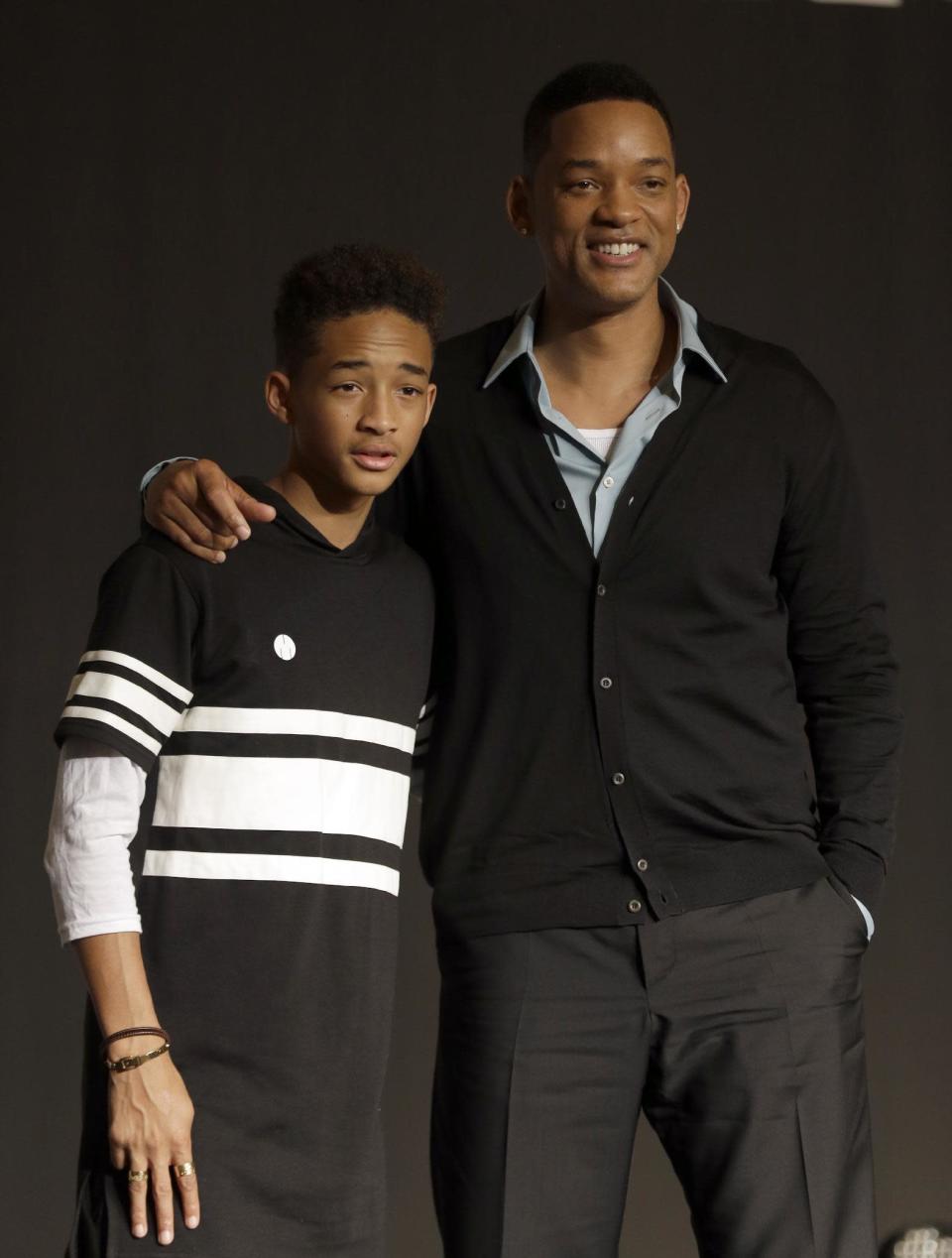 FILE - In this May 7, 2013 file photo, U.S. actor Will Smith and his son Jaden pose for the media after press conference for their film "After Earth" in Seoul, South Korea. Both actors were awarded Razzies for the film. Jaden was selected as worst actor for his role in the sci-fi flop about a father and son stranded on an untamed earth, while the elder Smith was chosen as worst supporting actor at the Golden Raspberry Awards, on Saturday, March 1, 2014, which lampoons Hollywood's awards season on the eve of the Oscars. (AP Photo/Lee Jin-man, file)