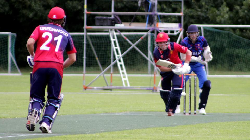 Action from Jersey v Serbia