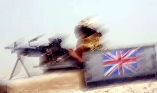 A British soldier provides security in Afghanistan's Helmand province. An Afghan police officer has killed three British soldiers serving with NATO in Afghanistan's troubled south, the latest in a series of escalating "green on blue" attacks in the decade-long war