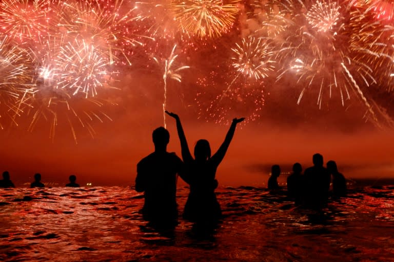 People watch fireworks during New Year celebrations at Copacabana beach in Rio de Janeiro