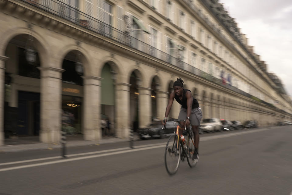 A man rides on Rivoli street, in Paris, Wednesday, Sept. 13, 2023. Years of efforts to turn car-congested Paris into a more bike-friendly city are paying off ahead of the 2024 Olympics, with increasing numbers of people using the French capital's growing network of cycle lanes. (AP Photo/John Leicester)