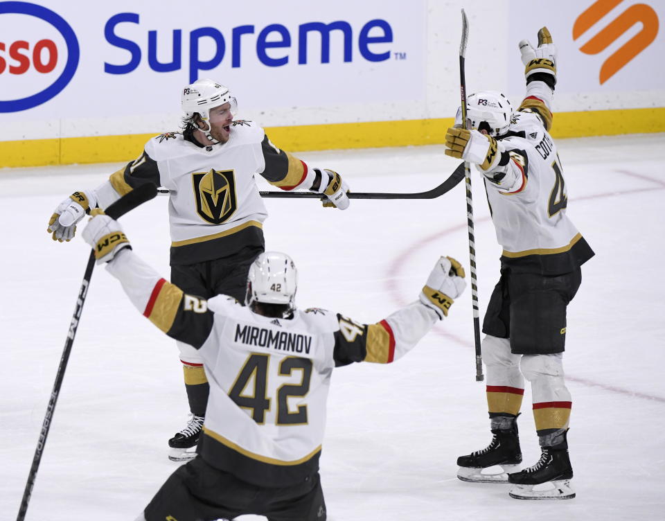 Vegas Golden Knights' Jonathan Marchessault (81) celebrates his goal against the Winnipeg Jets with Daniil Miromanov (42) and Paul Cotter (43) during the third period of an NHL hockey game in Winnipeg, Manitoba on Tuesday, Dec. 13, 2022. (Fred Greenslade/The Canadian Press via AP)