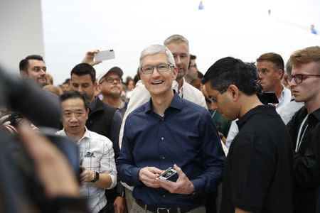 Tim Cook, CEO of Apple, speaks during a demonstration of the newly released Apple products following the launch event at the Steve Jobs Theater in Cupertino, California, U.S., September 12, 2018. REUTERS/Stephen Lam